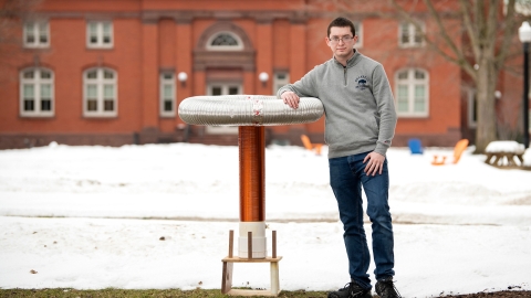 David Berry stands outside with his musical Tesla coil