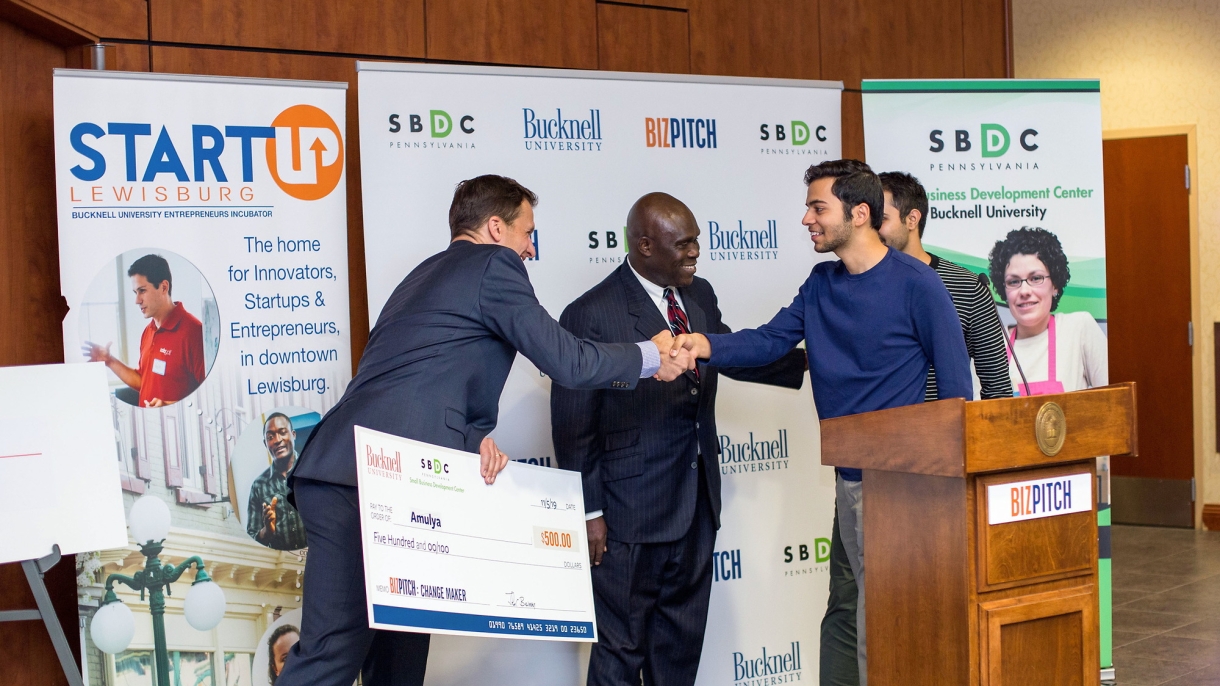 A BitPitch winner getting their check
