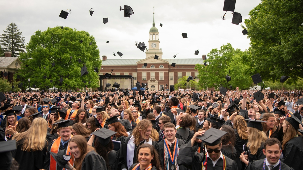 Graduates throw their caps at commencement
