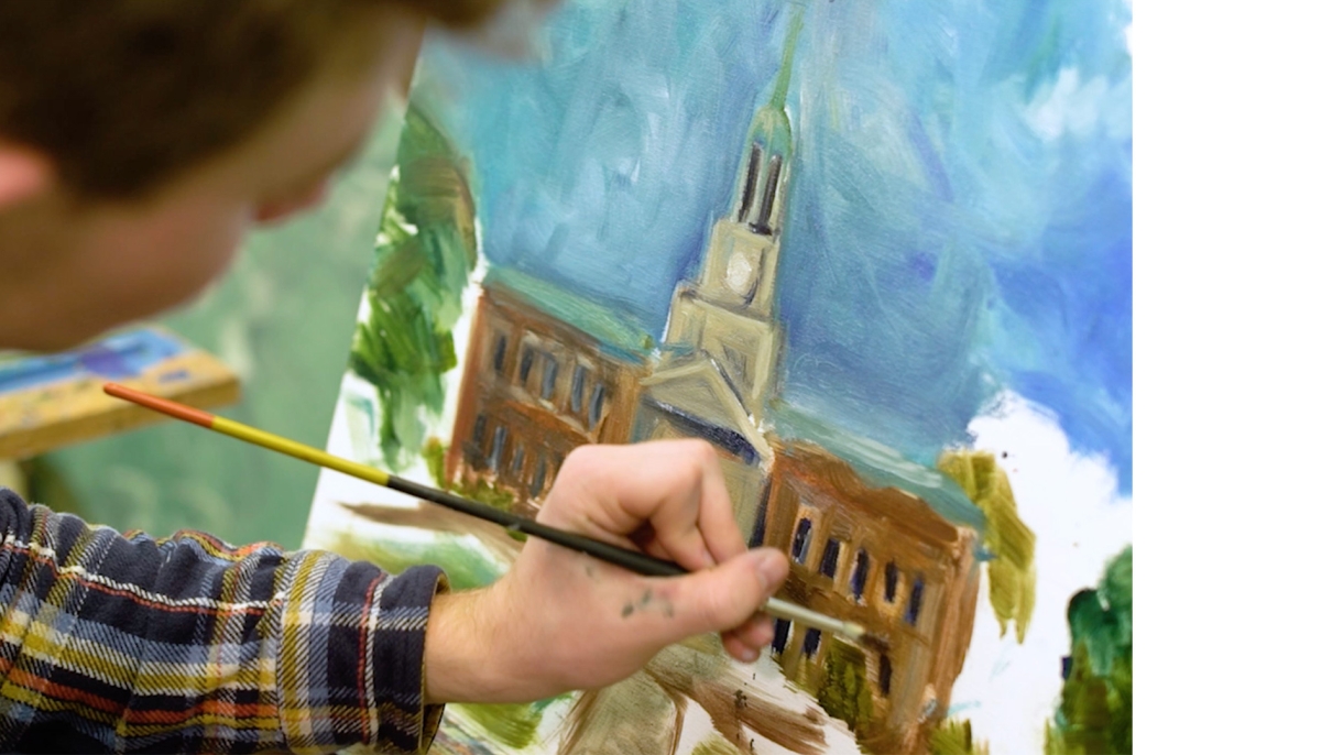 Student painting a picture