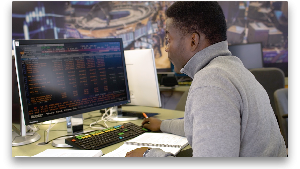 Student using computer showing coding.