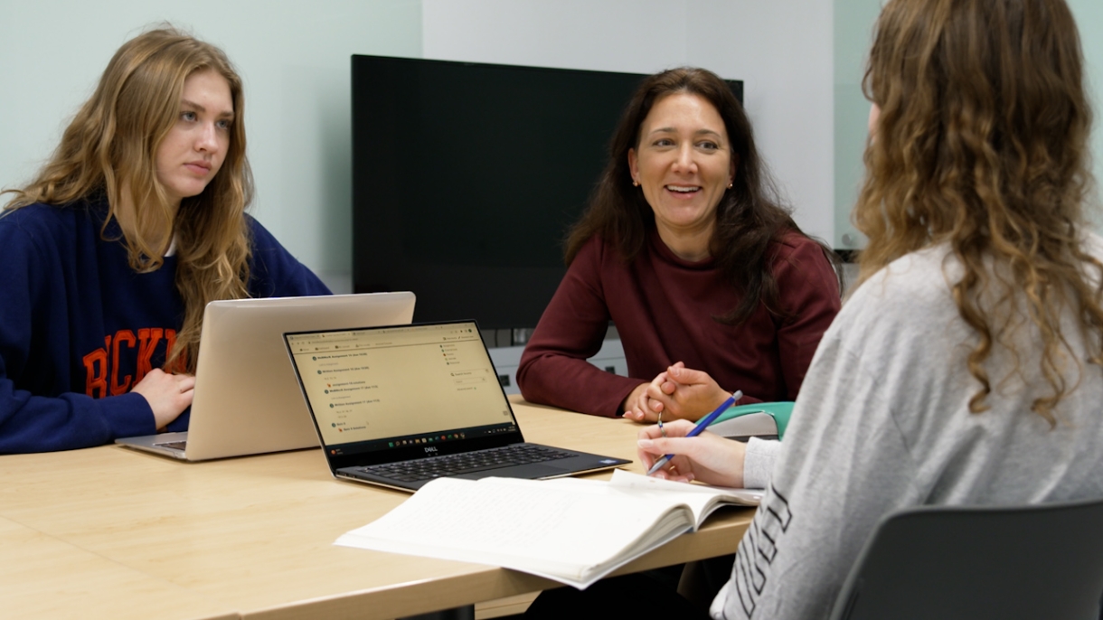 Women in a classroom with laptops
