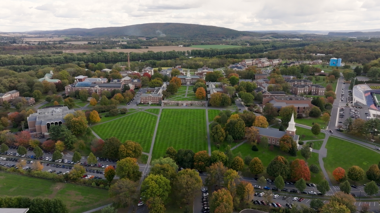 A drone perspective of Bucknell's sloping lawn, Malesardi Quadrangle, and Bertrand Library.