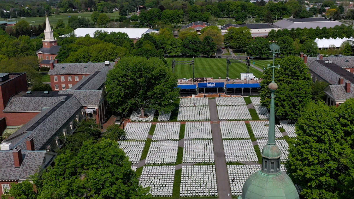 An aerial view of Malesardi Quadrangle from above Bertrand Library. The Commencement stage is setup at the far end of the quad, which is staged with chairs for the ceremony.