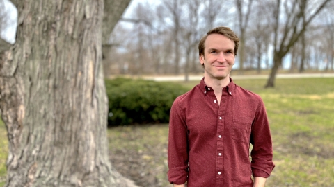 Portrait of Matt Kandler outside near a tree.