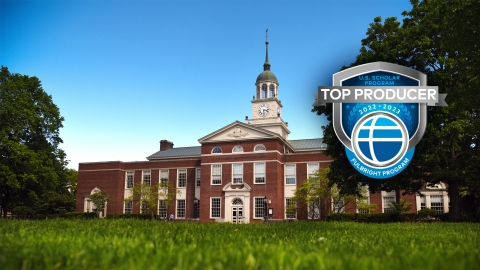 The Fulbright Top Producer emblem is laid over a photo of Bertrand Library