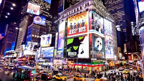 Broadway in New York City lights up at night