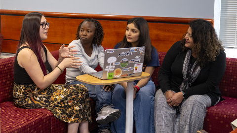 BU Magazine 2026 Winter Feature 1, four womean sitting around a table talking
