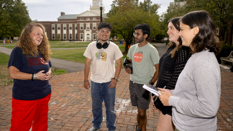 Mo and five students staning in the quad
