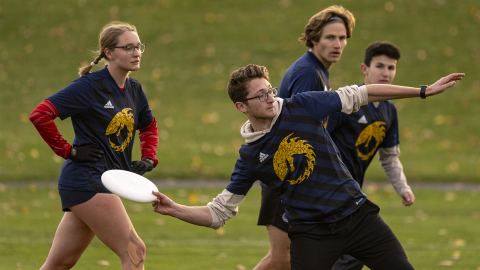 Students playing frisbee