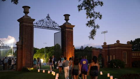 Students walk through gates