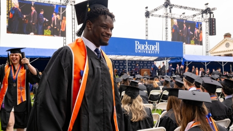 Graduates walk at Bucknell's 2024 Commencement