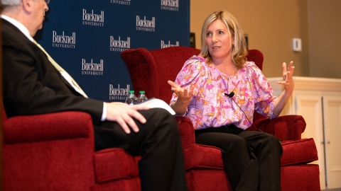 Barbara F. Walter &#039;86 sits on stage with Bucknell President John Bravman.