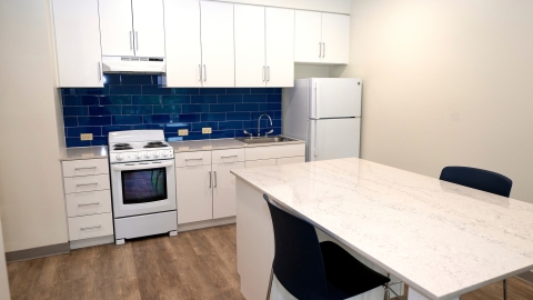 West Apartment kitchen, featuring a multifunctional island