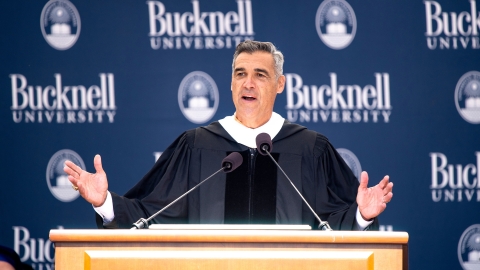 Jay Wright speaks behind the podium on stage at Bucknell&#039;s 173rd Commencement