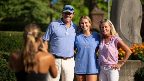 A family stands for a portrait