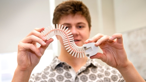 Caiden Covell &#039;25 bends the spine of his robot