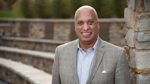 Frank Davis ’82 near the building named in his honor.