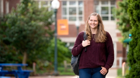 Emily Scholfield walks on campus