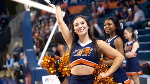 Faith Trejo cheers at a basketball game.