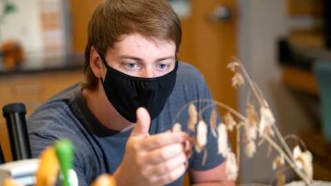 Portrait of student Jon Hayes in Herbarium