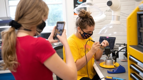 Computer engineering majors Rachel Cherrey '22 and Daniela Bellini '22 build circuit boards inside the Maker-E, Bucknell's electrical & computer engineering makerspace