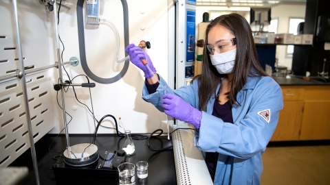 Mikayla performs an experiment in a lab