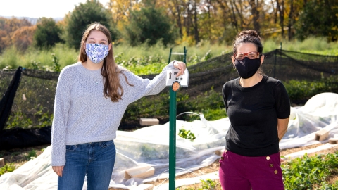 Riley Doyle and Deborah Sills with ag plastic at The Bucknell Farm. 