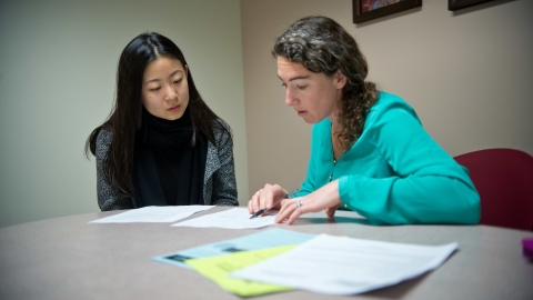 Megan Wolleben and a student go over a résumé.