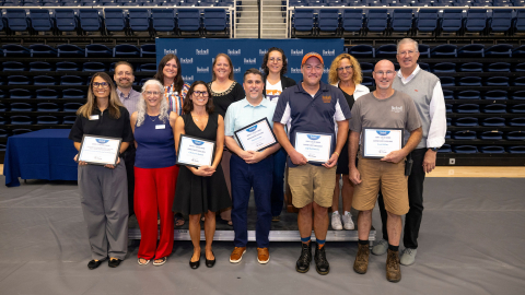 A group of Bucknellians stand together after receiving awards.