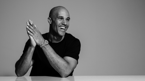 Mark Tallman smiles in this black and white image.