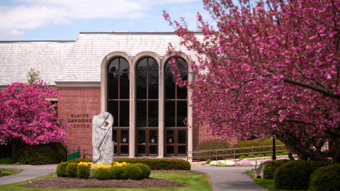Exterior of the ELC with cherry blossoms in bloom