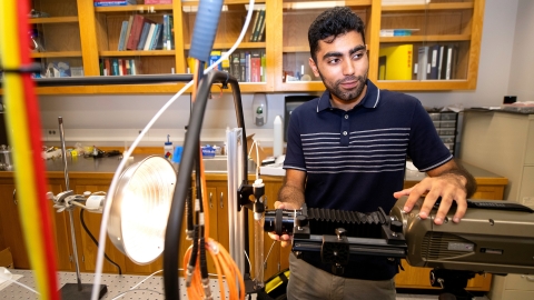 Abdullah Nabi in a mechanical engineering lab with research equipment