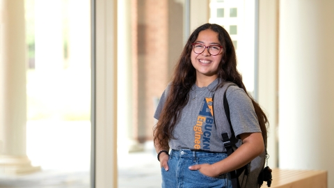 Cindy Cortez stands inside a hallway.