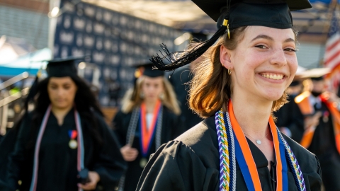 Graduates process into Commencement