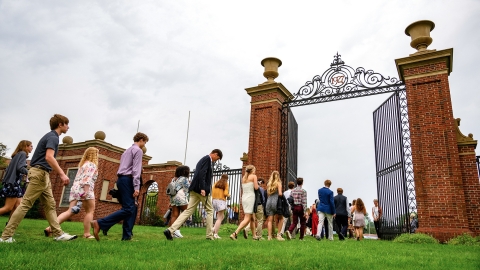 Students walking through the Bucknell gates. 