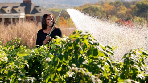 Maya Asante '24 waters crops