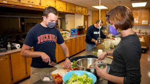 Paul Danenberg preparing food at Community Harvest in Milton