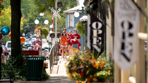 Students walking down the street in Lewisburg. 