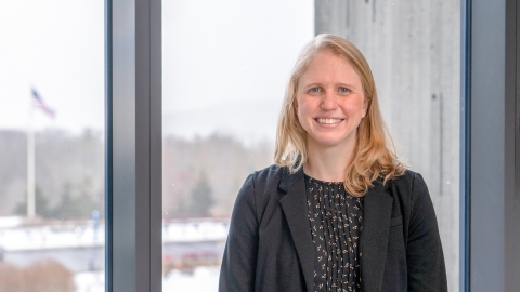 Laura Cook stands in front of a window at the Corning Museum of Glass