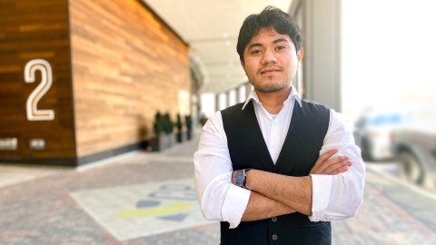 Manuel Teshe '23 poses outside building