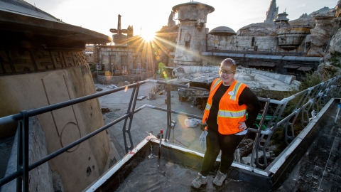 Rachel Sherbill &#039;09 stands in front of the Millennium Falcon