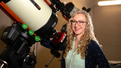 Professor Jackie Villadsen stands by a telescope in the Bucknell Observatory..JPG