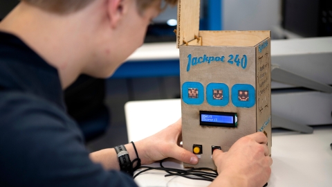 Jack Casturo '24 tinkers with hand-made slot machine