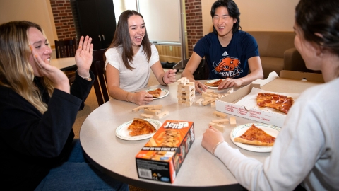 Natalia Mancero '24 enjoys pizza and Jenga with hallmates
