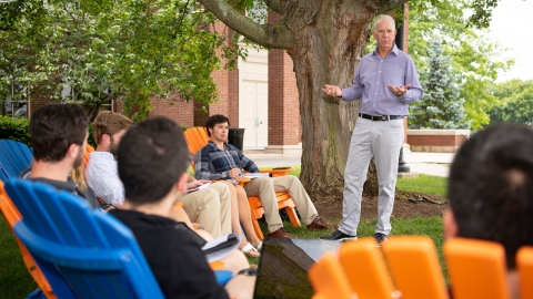 Professor Neil Boyd teaches a class to students on Malesardi Quad