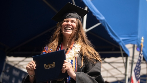 Graduate happily walks across stage