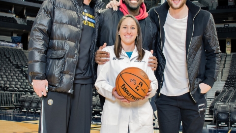 Alison Hoover with Denver Nuggets players