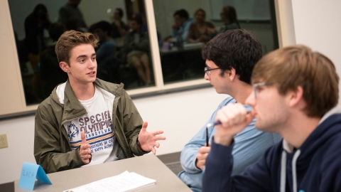 Student leads a group discussion in class