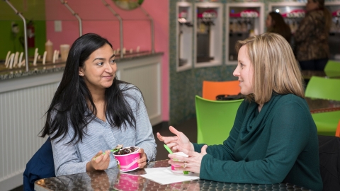 Two people eating Sweet Frog